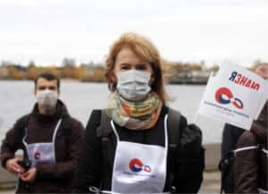 three-people-wearing-masks-outside