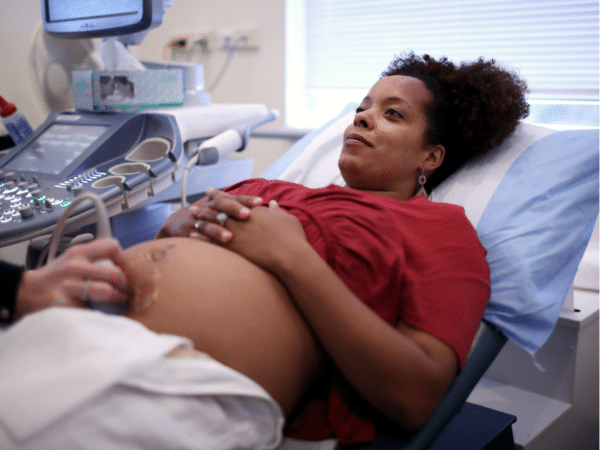 1 Pregnant woman speaking to her doctor about blood clot risks