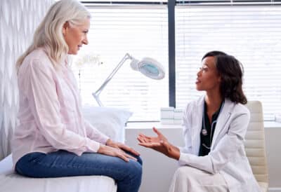Mature Woman In Consultation With Female Doctor Sitting On Examination Couch In Office Anticoagulation, or blood-thinning medicine, is the foundation of CVST treatment